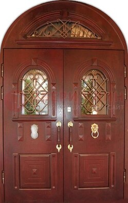Стальная арочная дверь со стеклом и ковкой ДА-30 в дом из кирпича в Рязани