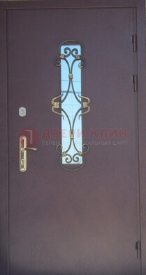 Металлическая дверь со стеклом и ковкой ДСК-77 в Рязани